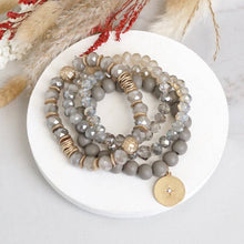 Beaded bracelets set in Gray with a coin charm